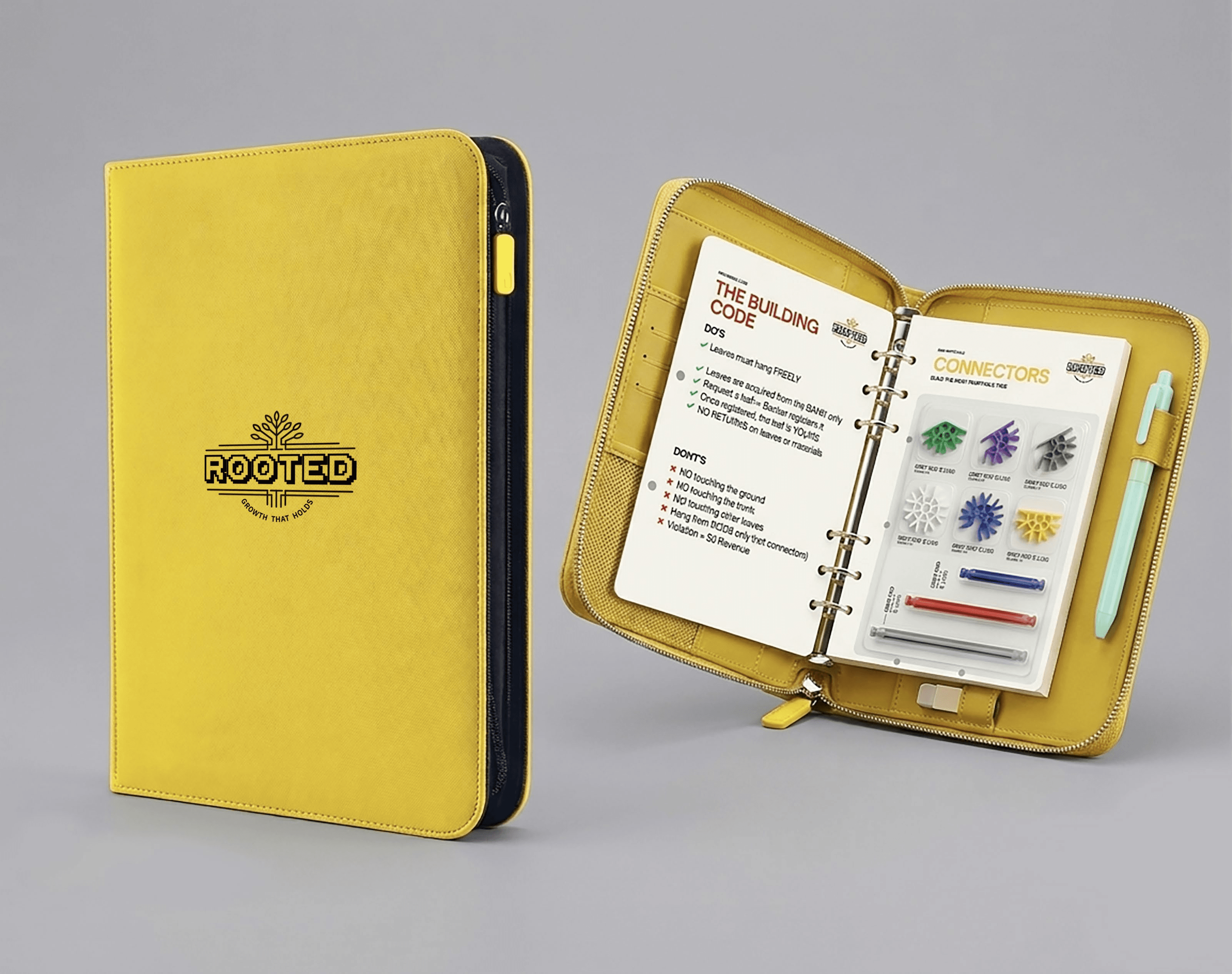 The Rooted participant kit: an A5 branded zip folio, open to the ring-bound Building Code and connector reference sheets.